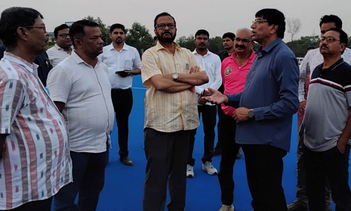 Minister Pujari Inspects Progress at Hockey Stadium