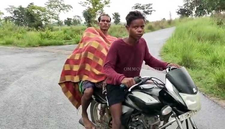 Husband Transports Deceased Wife on Motorcycle Due to Absence of Hearse in Jharsuguda